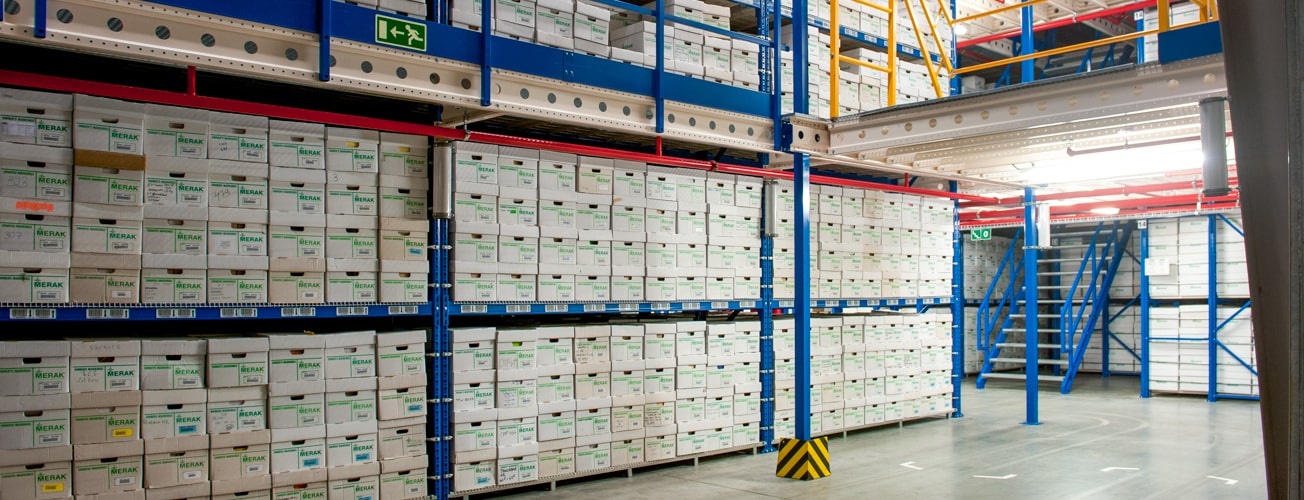 Storage racks filled with stacked Merak archive boxes
