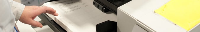 Close-up of scanner used by an employee