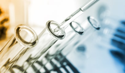 A liquid is put into test tubes with a pipette