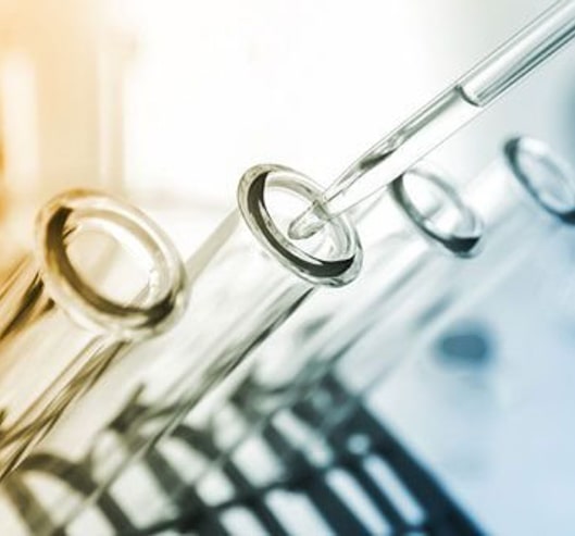 A liquid is put into test tubes with a pipette